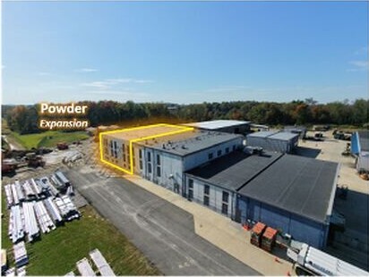 Aerial photograph of 6K Additive’s Burgettstown facility, with a yellow outline marking the powder expansion area.