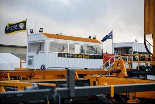 Mitchell Services drilling equipment and rig components at an outdoor operating yard.